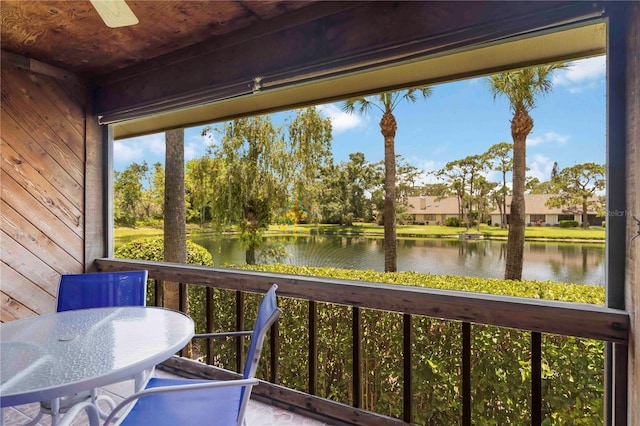 7926 Woodpointe Ct Unit 29, Sarasota, FL 34238 - sunroom / solarium with a water view and view of wooded area