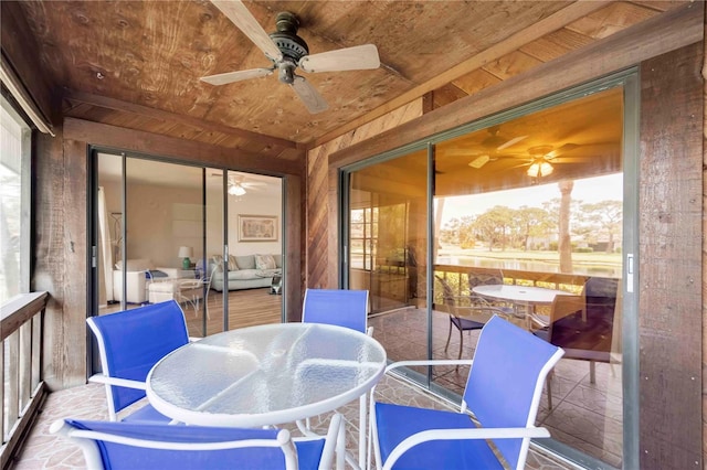 7926 Woodpointe Ct Unit 29, Sarasota, FL 34238 - sunroom with a ceiling fan and outdoor dining area