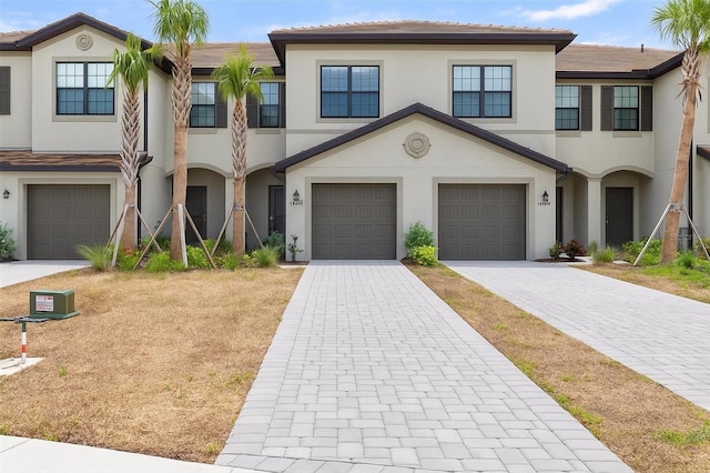 14835 Lyla Ter, Bradenton, FL 34211 - view of property with stucco siding, an attached garage, and decorative driveway