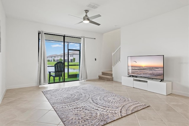 14835 Lyla Ter, Bradenton, FL 34211 - living area with tile patterned floors, baseboards, stairs, and ceiling fan