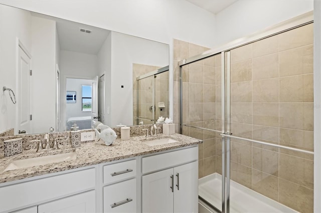 14835 Lyla Ter, Bradenton, FL 34211 - ensuite bathroom featuring double vanity and a shower stall