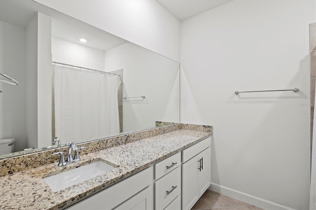 14835 Lyla Ter, Bradenton, FL 34211 - bathroom with vanity, toilet, tile patterned flooring, baseboards, and a shower with shower curtain