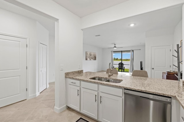 14835 Lyla Ter, Bradenton, FL 34211 - kitchen featuring stainless steel dishwasher, a sink, a ceiling fan, light stone counters, and recessed lighting