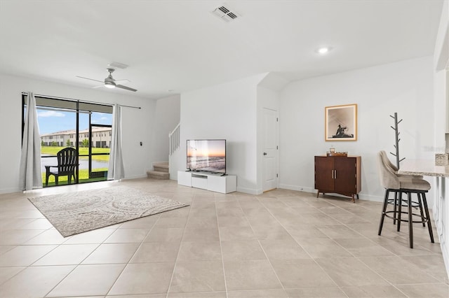 14835 Lyla Ter, Bradenton, FL 34211 - living area featuring light tile patterned floors, ceiling fan, stairs, and recessed lighting