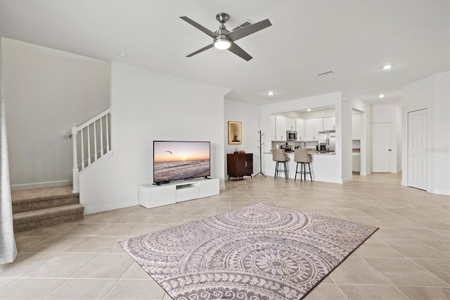 14835 Lyla Ter, Bradenton, FL 34211 - living room with light tile patterned flooring, ceiling fan, stairs, recessed lighting, and baseboards