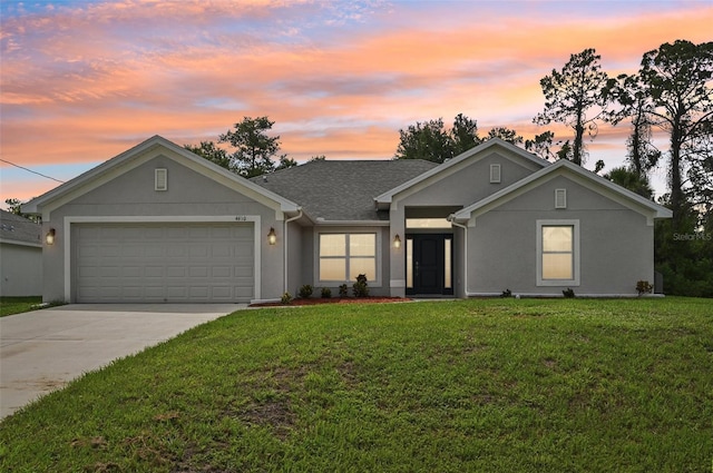 4610 Clarke St, North Port, FL 34286 - ranch-style home featuring a yard, a garage, driveway, stucco siding, and a shingled roof