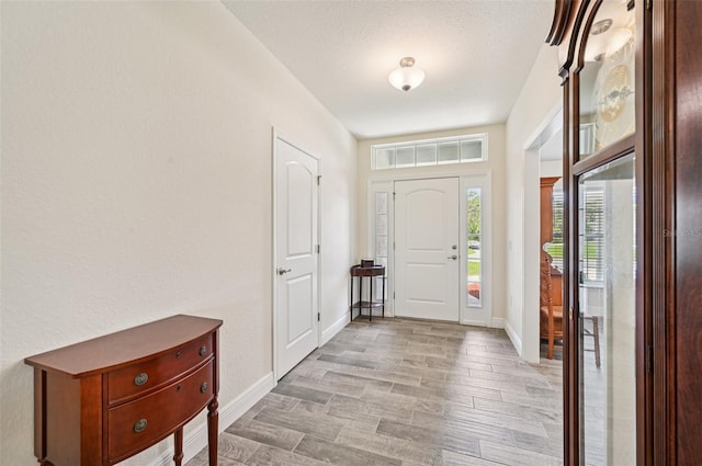 4610 Clarke St, North Port, FL 34286 - foyer featuring baseboards and light wood finished floors