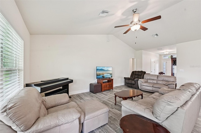 4610 Clarke St, North Port, FL 34286 - living room featuring wood tiled floors, lofted ceiling, ceiling fan, and baseboards