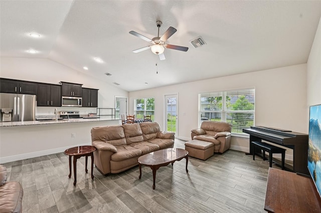 4610 Clarke St, North Port, FL 34286 - living room featuring lofted ceiling, ceiling fan, light wood finished floors, baseboards, and recessed lighting