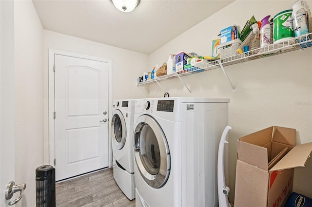 4610 Clarke St, North Port, FL 34286 - washroom with separate washer and dryer and light wood-style flooring
