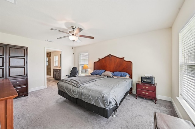 4610 Clarke St, North Port, FL 34286 - bedroom with light colored carpet, baseboards, and connected bathroom
