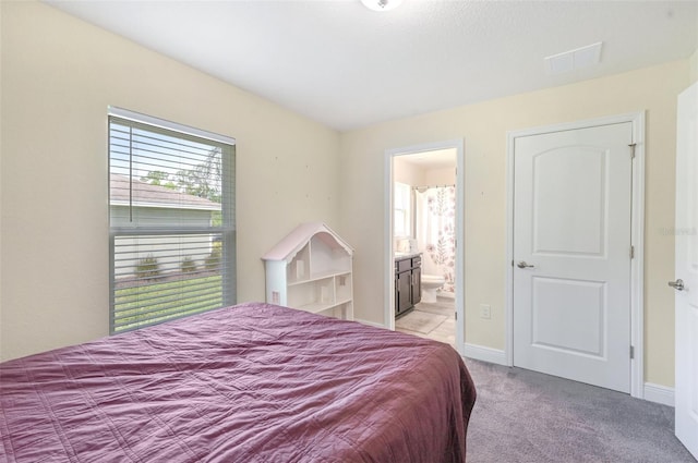 4610 Clarke St, North Port, FL 34286 - bedroom featuring carpet floors, ensuite bath, and baseboards