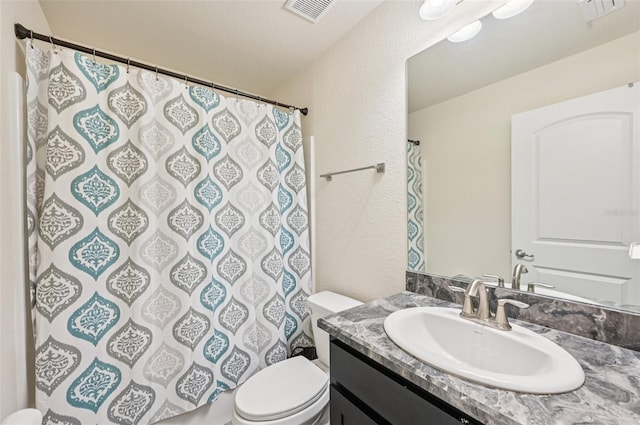 4610 Clarke St, North Port, FL 34286 - bathroom with toilet, a textured wall, vanity, and curtained shower