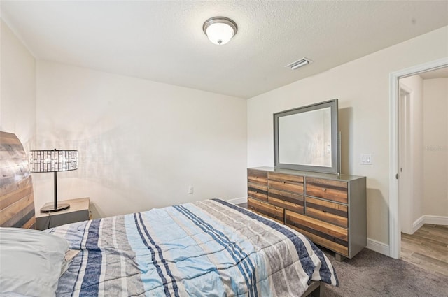 4610 Clarke St, North Port, FL 34286 - carpeted bedroom with baseboards and a textured ceiling
