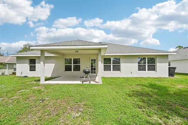 4610 Clarke St, North Port, FL 34286 - rear view of property featuring a patio, stucco siding, a lawn, and a shingled roof