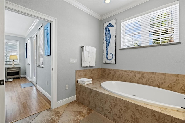 145 50th St, Holmes Beach, FL 34217 - bathroom featuring ornamental molding and a garden tub