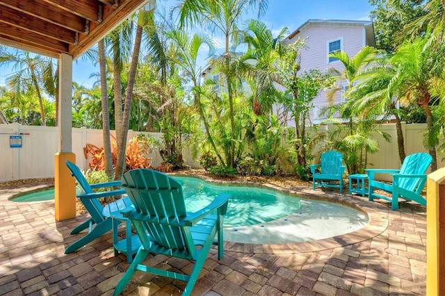 145 50th St, Holmes Beach, FL 34217 - view of swimming pool featuring a patio and a fenced backyard