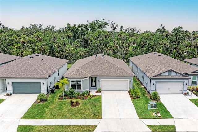 3129 61st Ter E, Ellenton, FL 34222 - ranch-style house with driveway, a front lawn, stucco siding, and an attached garage