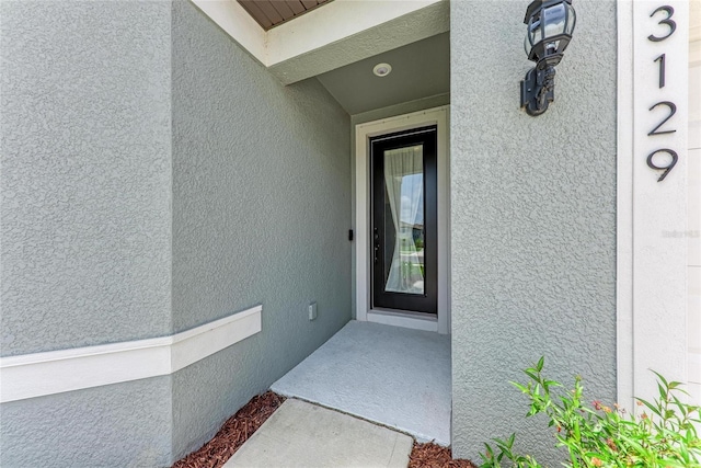 3129 61st Ter E, Ellenton, FL 34222 - doorway to property with stucco siding
