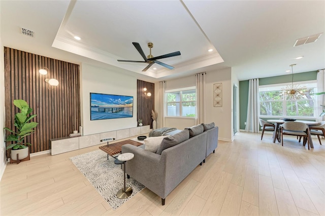 3129 61st Ter E, Ellenton, FL 34222 - living room featuring a tray ceiling, ceiling fan, light wood-type flooring, baseboards, and recessed lighting