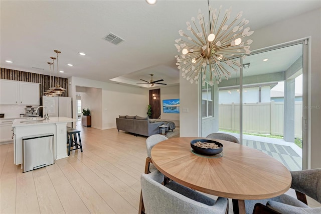 3129 61st Ter E, Ellenton, FL 34222 - dining space featuring a ceiling fan, recessed lighting, light wood-style floors, a chandelier, and baseboards