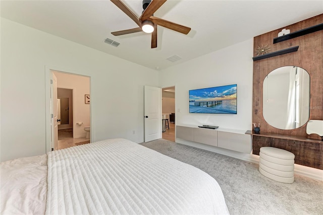 3129 61st Ter E, Ellenton, FL 34222 - bedroom featuring light colored carpet, ensuite bath, and a ceiling fan