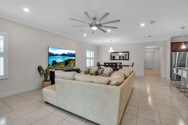 3712 76th St E, Palmetto, FL 34221 - living area featuring light tile patterned floors, a ceiling fan, crown molding, baseboards, and recessed lighting