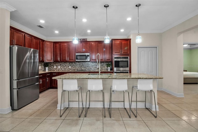 3712 76th St E, Palmetto, FL 34221 - kitchen with stainless steel appliances, a sink, dark brown cabinets, light tile patterned floors, and backsplash