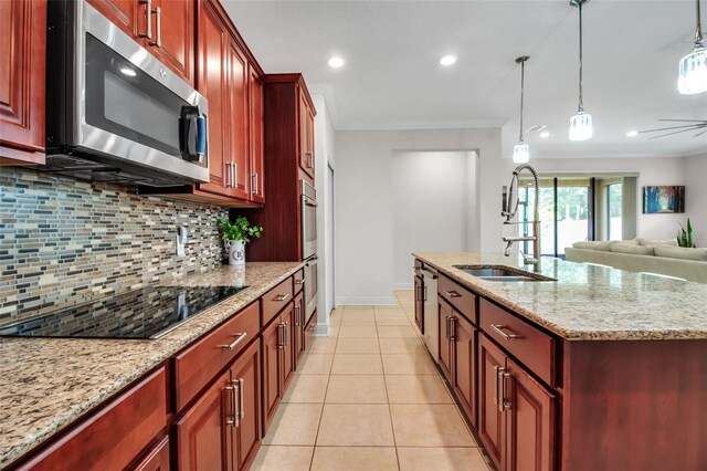 3712 76th St E, Palmetto, FL 34221 - kitchen featuring appliances with stainless steel finishes, ornamental molding, a sink, backsplash, and reddish brown cabinets