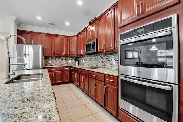 3712 76th St E, Palmetto, FL 34221 - kitchen featuring appliances with stainless steel finishes, ornamental molding, light tile patterned floors, backsplash, and a sink