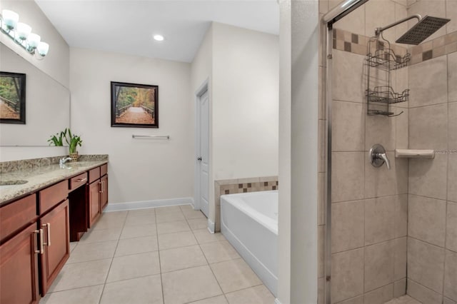 3712 76th St E, Palmetto, FL 34221 - bathroom with double vanity, a bath, a shower stall, tile patterned floors, and recessed lighting
