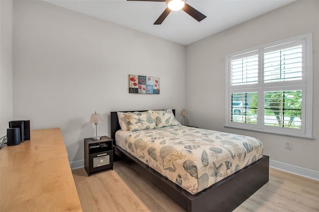 3712 76th St E, Palmetto, FL 34221 - bedroom with light wood-type flooring, baseboards, and ceiling fan
