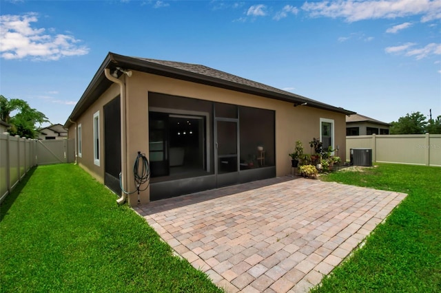 3712 76th St E, Palmetto, FL 34221 - rear view of house with a sunroom, stucco siding, a patio area, and cooling unit