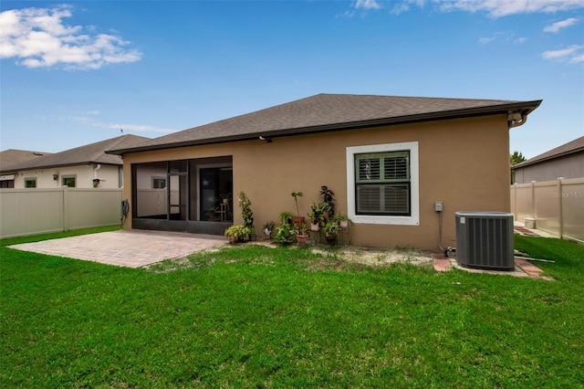 3712 76th St E, Palmetto, FL 34221 - rear view of house with central AC unit, a sunroom, a patio area, and stucco siding