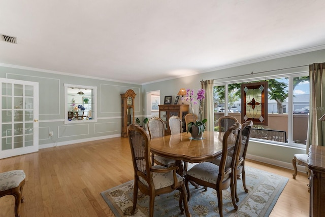 715 Fontana Ln, Bradenton, FL 34209 - dining area with ornamental molding, light wood-type flooring, and baseboards