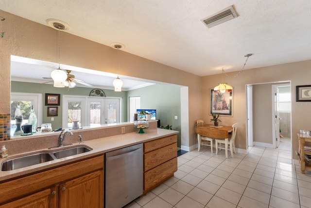 715 Fontana Ln, Bradenton, FL 34209 - kitchen featuring dishwasher, a sink, brown cabinets, and healthy amount of natural light