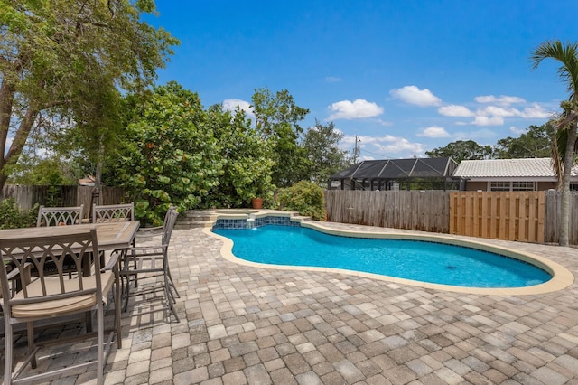 715 Fontana Ln, Bradenton, FL 34209 - view of pool with a patio area, a fenced backyard, outdoor dining area, and a hot tub
