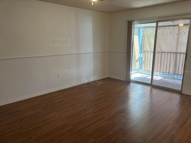 10800 N US Highway 19 Unit 237, Pinellas Park, FL 33782 - spare room featuring wood finished floors, wainscoting, and ceiling fan