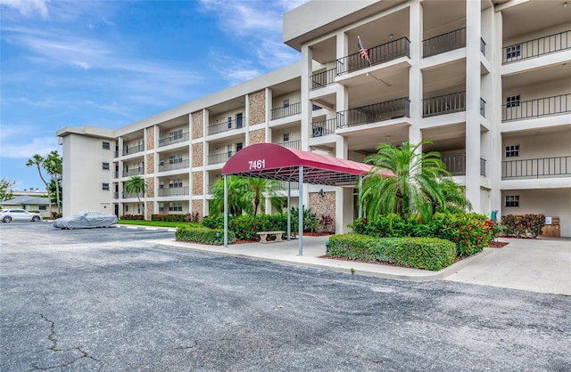 7461 W Country Club Dr N Unit 203, Sarasota, FL 34243 - view of apartment building / complex featuring uncovered parking
