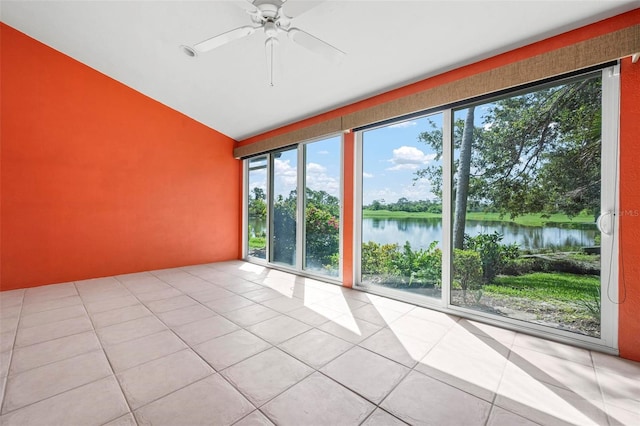 4472 Calle Serena, Sarasota, FL 34238 - spare room featuring plenty of natural light, tile patterned floors, a water view, lofted ceiling, and a ceiling fan