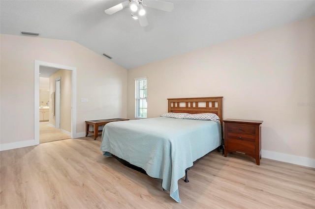 4472 Calle Serena, Sarasota, FL 34238 - bedroom with light wood finished floors, lofted ceiling, baseboards, ceiling fan, and ensuite bath
