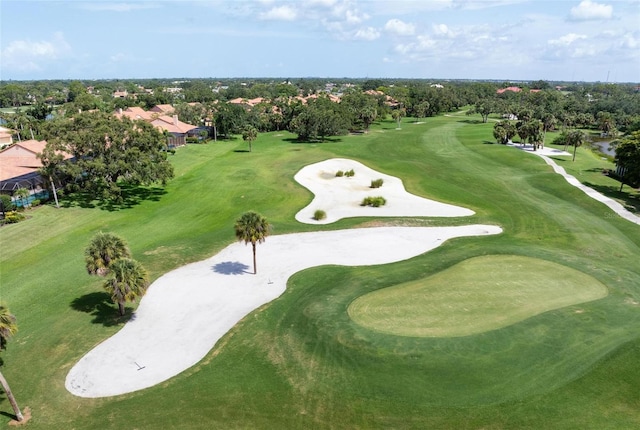 4472 Calle Serena, Sarasota, FL 34238 - aerial overview of property's location featuring a golf course, a tree filled landscape, and nearby suburban area