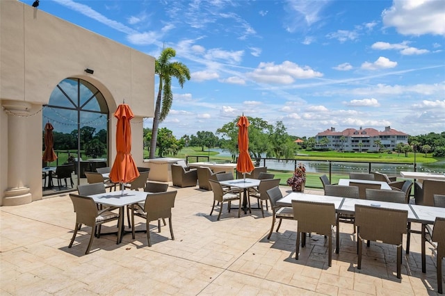 4472 Calle Serena, Sarasota, FL 34238 - view of patio / terrace with outdoor dining space and a water view