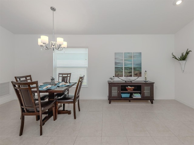12682 Shimmering Oak Cir, Venice, FL 34293 - dining space featuring a chandelier and light tile patterned floors