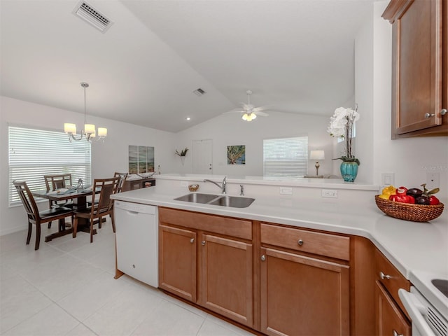 12682 Shimmering Oak Cir, Venice, FL 34293 - kitchen featuring white dishwasher, a peninsula, light countertops, lofted ceiling, and ceiling fan
