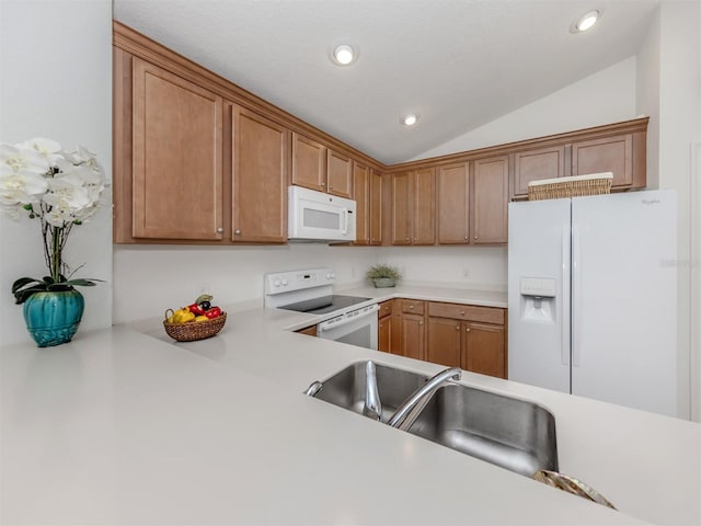 12682 Shimmering Oak Cir, Venice, FL 34293 - kitchen with white appliances, vaulted ceiling, light countertops, recessed lighting, and brown cabinets