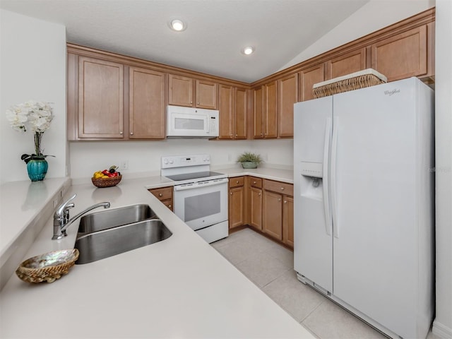 12682 Shimmering Oak Cir, Venice, FL 34293 - kitchen with white appliances, light tile patterned floors, light countertops, brown cabinetry, and recessed lighting