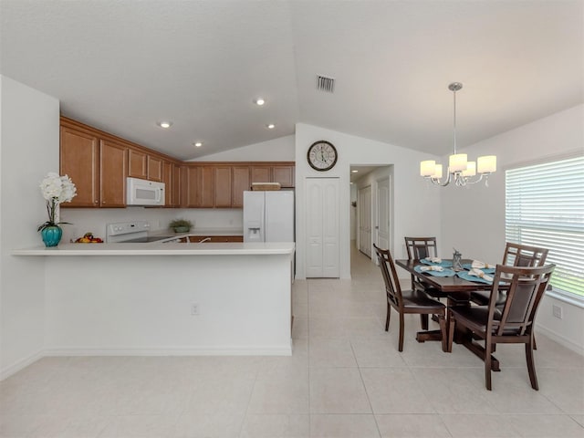12682 Shimmering Oak Cir, Venice, FL 34293 - kitchen with white appliances, vaulted ceiling, a chandelier, light countertops, and brown cabinets