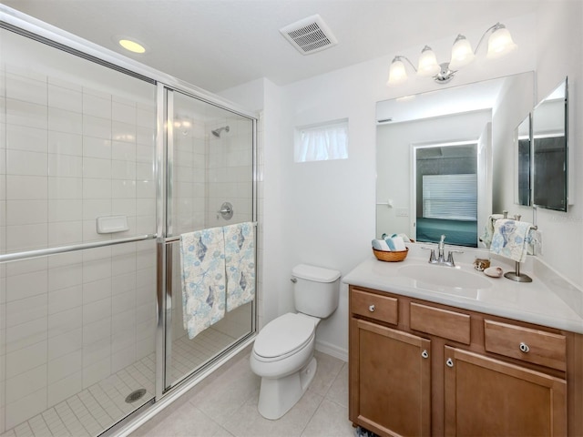 12682 Shimmering Oak Cir, Venice, FL 34293 - bathroom featuring vanity, a shower stall, and tile patterned floors