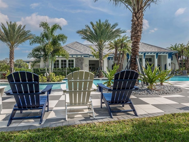 12682 Shimmering Oak Cir, Venice, FL 34293 - view of patio / terrace featuring a community pool